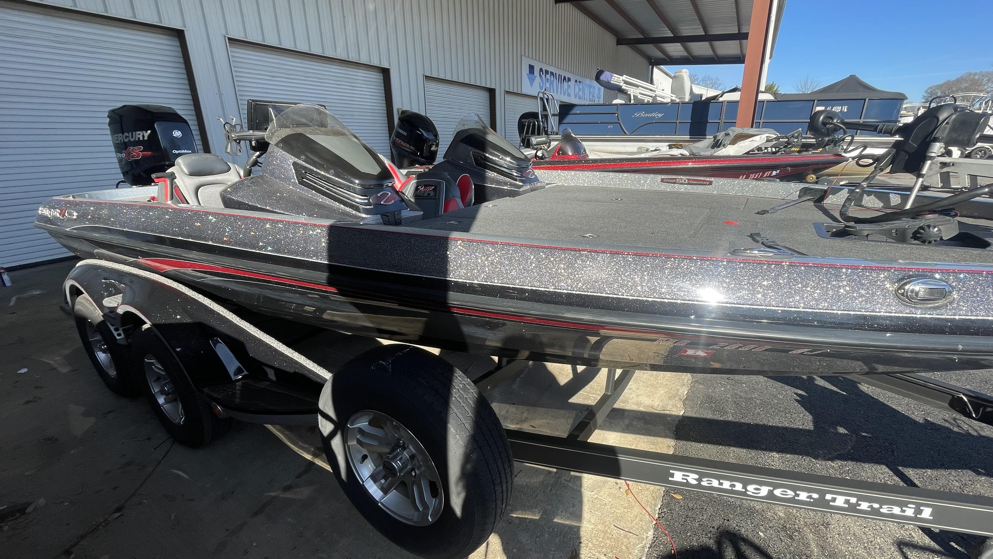 Slide: The Image of 2018 Ranger Z519C bass boat on a trailer at a service center. - 3