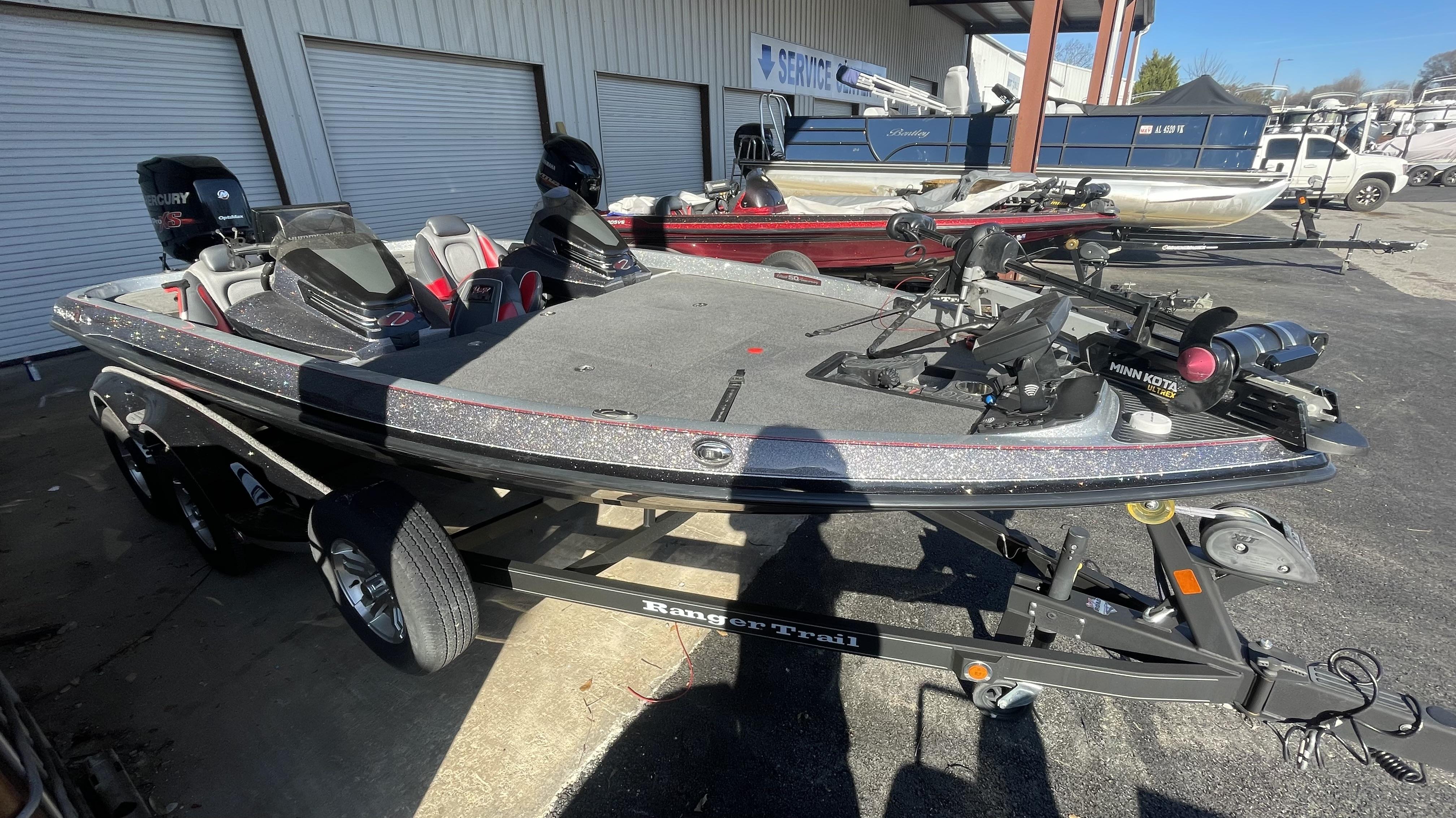 Slide: The Image of 2018 Ranger Z519C bass boat on trailer in a boatyard. - 4