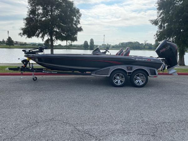 Slide: The Image of 2024 Ranger Z520R Ranger Cup Equipped boat parked near a lake. - 0