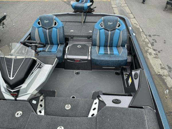 Slide: The Image of 2024 Ranger Z520R Ranger Cup Equipped boat interior with blue and gray seats. - 7