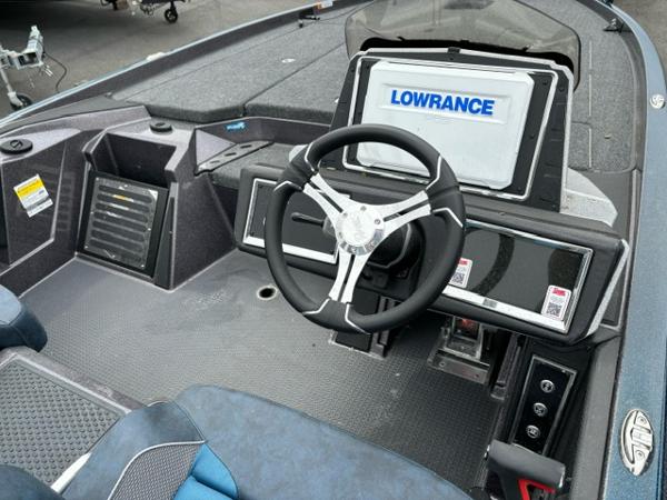 Slide: The Image of 2024 Ranger Z520R Ranger Cup Equipped boat cockpit with Lowrance electronics and steering wheel. - 8
