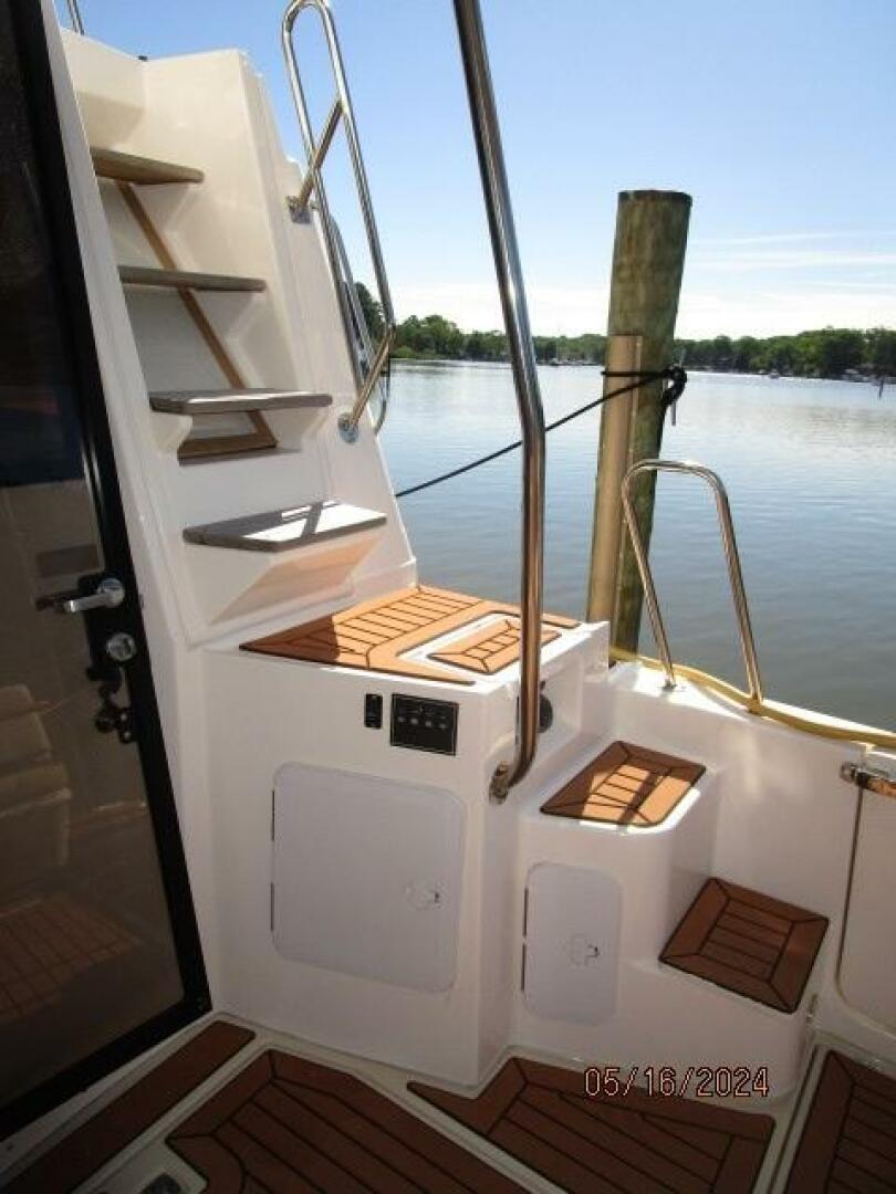 Slide: The Image of 43' Ranger Tugs aftdeck-flybridge stairs - 4375131