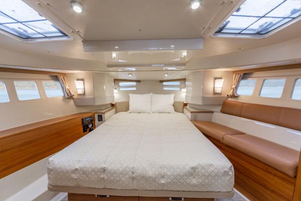 Slide: The Image of Luxurious bedroom interior of 2025 Ranger Tugs R-43 Command Bridge yacht. - 15