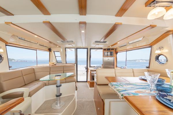 Slide: The Image of Luxurious interior of 2025 Ranger Tugs R-43 Command Bridge yacht with ocean view. - 8