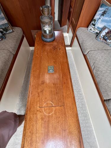 Slide: The Image of 1979 Ranger Yachts 30 interior with wooden table and nautical decor. - 20