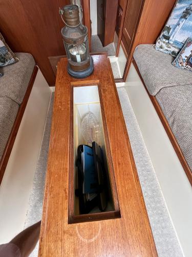 Slide: The Image of 1979 Ranger Yachts 30 interior with wooden table and vintage lantern. - 21