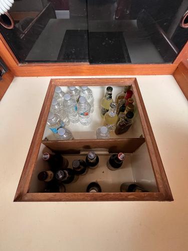 Slide: The Image of Built-in cooler with drinks on a 1979 Ranger Yachts 30. - 35