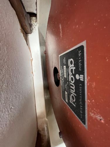 Slide: The Image of 1979 Ranger Yachts 30 engine compartment with Atomic 4 engine label. - 40