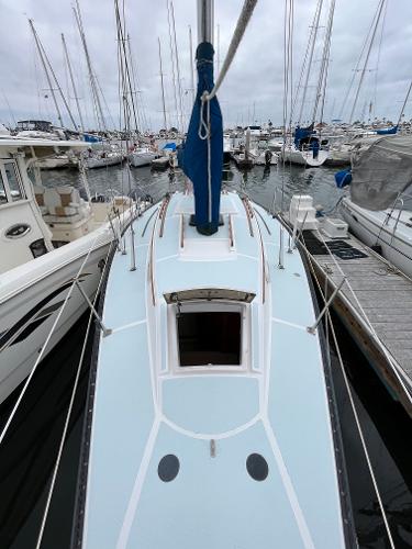 Slide: The Image of 1979 Ranger Yachts 30 sailboat docked in a marina. - 7