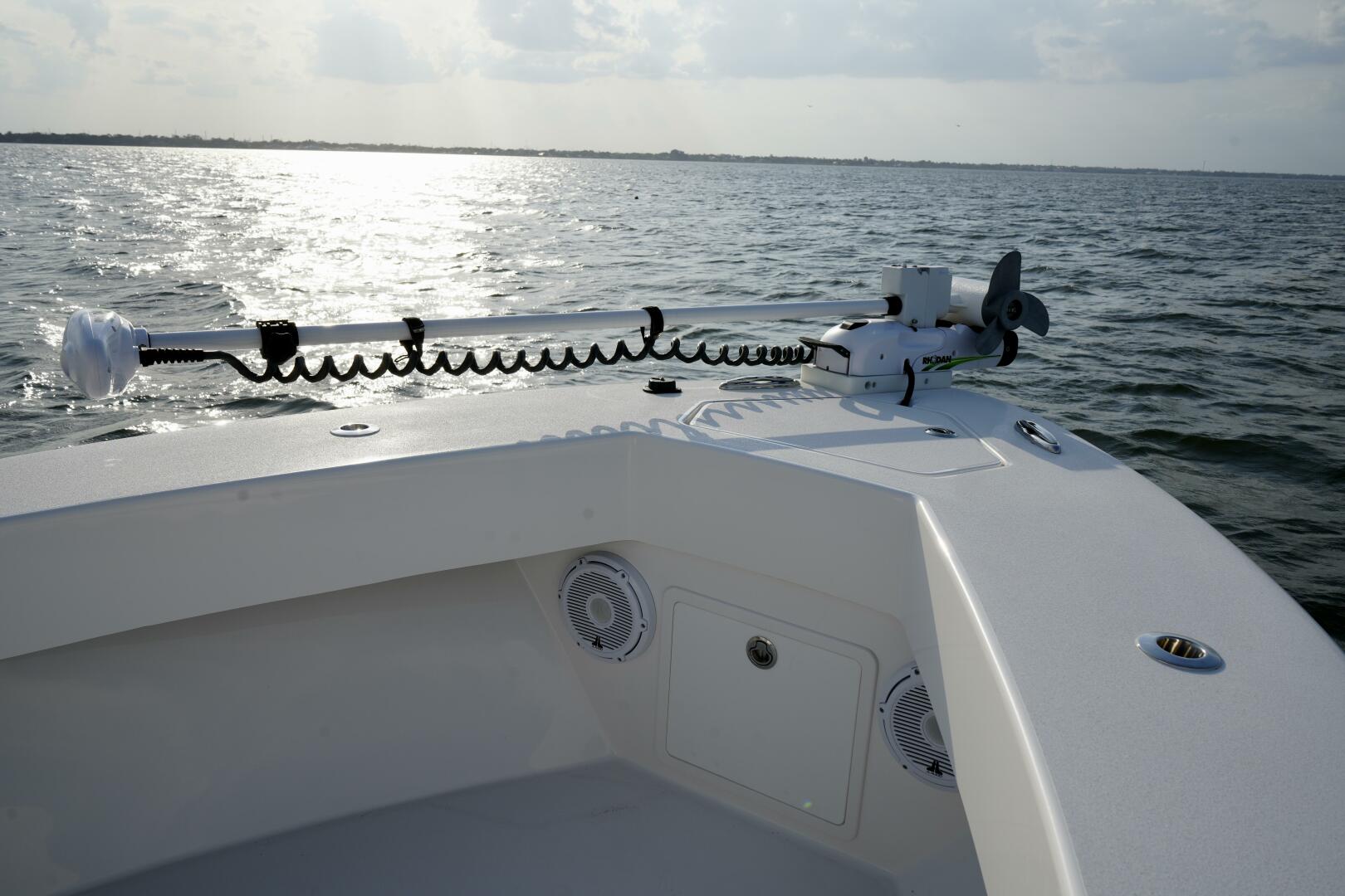 Slide: The Image of Bow with Trolling Motor 2024 Reef Runner 23 Center Console - 5205081