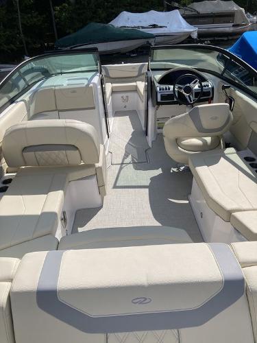 Slide: The Image of 2022 Regal 22 FasDeck boat interior with luxurious seating and modern dashboard. - 1