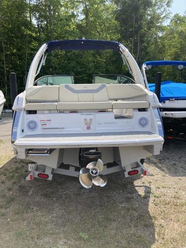 Slide: The Image of 2022 Regal 22 FasDeck boat, rear view, parked outdoors. - 4
