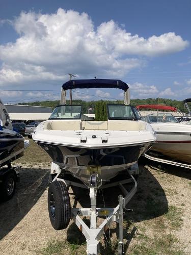 Slide: The Image of 2022 Regal 22 FasDeck boat on trailer under blue sky. - 8