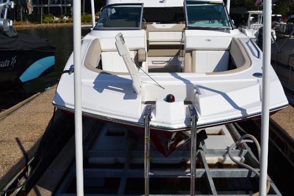 Slide: The Image of 2013 Regal 24 FasDeck boat on trailer, docked at marina. - 11
