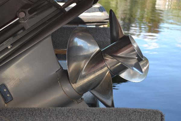 Slide: The Image of Close-up of a 2013 Regal 24 FasDeck boat propeller by the water. - 35