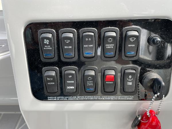 Slide: The Image of Control panel of a 2021 Regal 26 Express boat with labeled switches. - 10