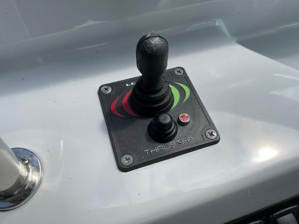 Slide: The Image of Joystick control on 2021 Regal 26 Express boat dashboard. - 11