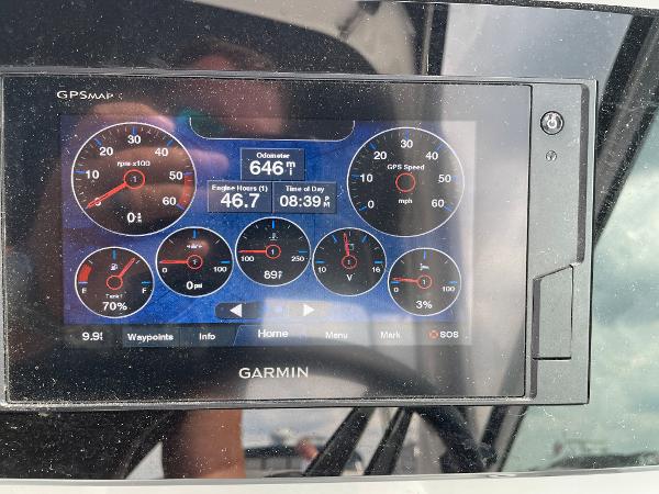 Slide: The Image of Garmin GPS display on 2021 Regal 26 Express boat dashboard showing engine metrics. - 13