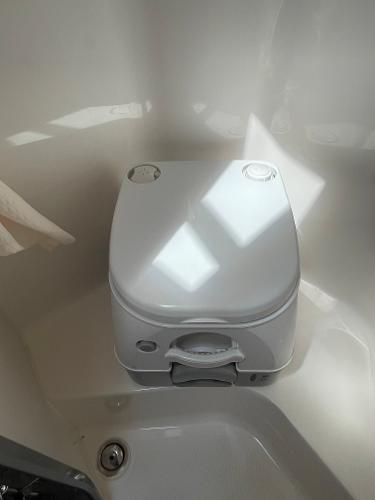Slide: The Image of Portable toilet in 2021 Regal 26 Express boat bathroom. - 24