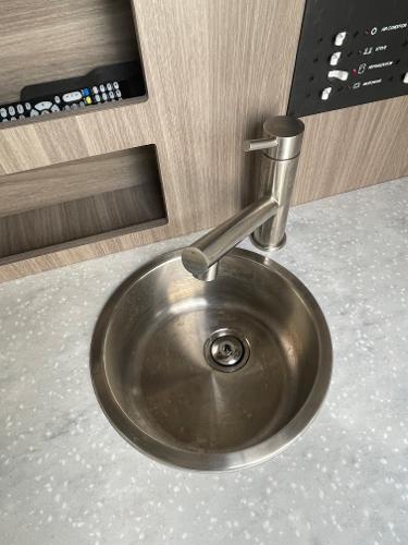 Slide: The Image of Stainless steel sink in 2021 Regal 26 Express boat interior. - 27
