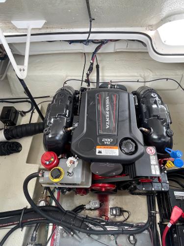 Slide: The Image of 2021 Regal 26 Express engine compartment with Volvo Penta 280 V6 engine. - 28