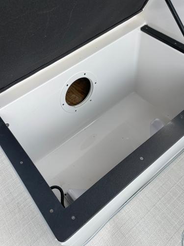Slide: The Image of Open storage compartment in a 2021 Regal 26 Express boat. - 31