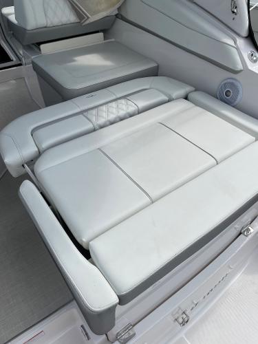 Slide: The Image of 2021 Regal 26 Express boat interior with luxurious white seating. - 34