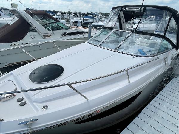 Slide: The Image of 2021 Regal 26 Express boat docked at marina, featuring sleek design and spacious deck. - 8