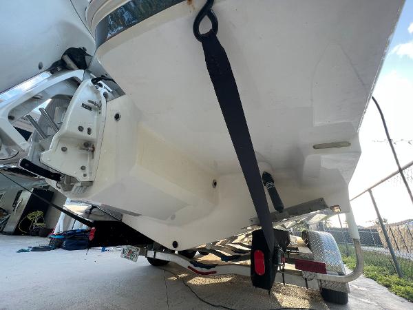 Slide: The Image of 2020 Regal 26 XO boat on trailer, rear view showing hull and outboard motor. - 10