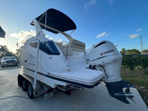 Slide: The Image of 2020 Regal 26 XO boat with Yamaha outboard engine on trailer. - 2