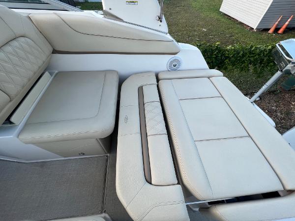 Slide: The Image of 2020 Regal 26 XO boat interior with beige leather seating and speaker detail. - 24