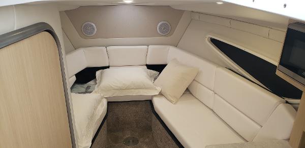 Slide: The Image of 2025 Regal 26 XO cabin interior with white seating and modern design. - 10