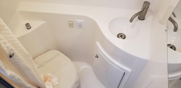 Slide: The Image of Compact bathroom in 2025 Regal 26 XO boat with sink and toilet. - 17
