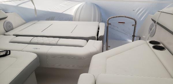 Slide: The Image of 2025 Regal 26 XO boat interior with white seating and cup holders. - 20