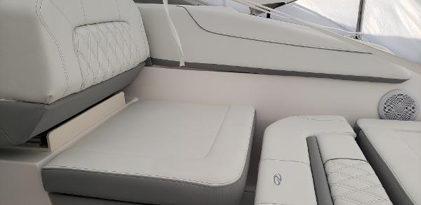 Slide: The Image of 2025 Regal 26 XO boat interior with luxurious white seating and modern design. - 21
