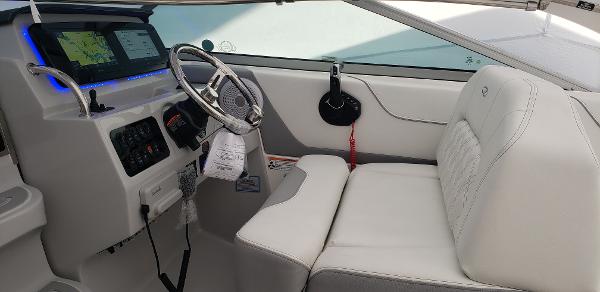 Slide: The Image of 2025 Regal 26 XO boat interior with modern dashboard and white seating. - 4