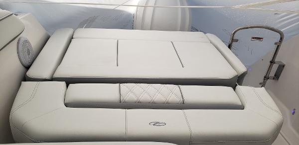Slide: The Image of 2025 Regal 26 XO boat interior with luxurious white seating and elegant design. - 5