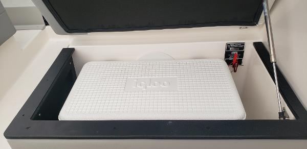Slide: The Image of Storage compartment with Igloo cooler in 2025 Regal 26 XO boat. - 8