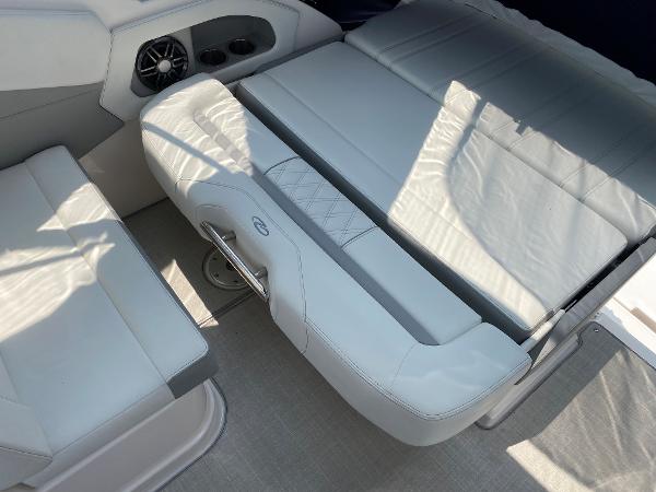 Slide: The Image of Interior seating of 2025 Regal 28 Express boat with white leather upholstery. - 23