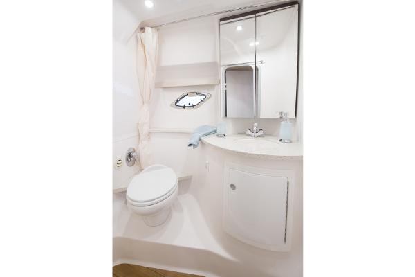 Slide: The Image of Manufacturer Provided Image: 2016 Regal 35 Sport Coupe bathroom with modern fixtures and white cabinetry. - 11