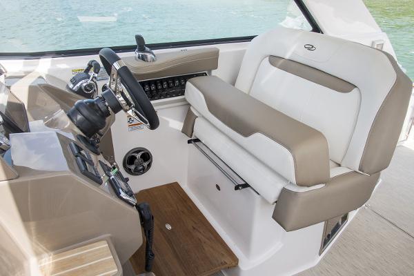 Slide: The Image of Manufacturer Provided Image: 2016 Regal 35 Sport Coupe helm with beige and white seating. - 5