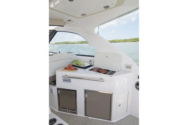 Slide: The Image of Manufacturer Provided Image: 2016 Regal 35 Sport Coupe yacht interior with outdoor kitchen and grill. - 8