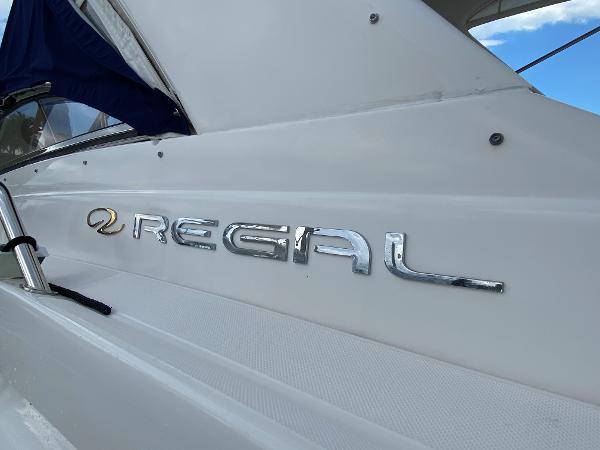 Slide: The Image of 2004 Regal 3860 Commodore boat exterior with logo. - 13