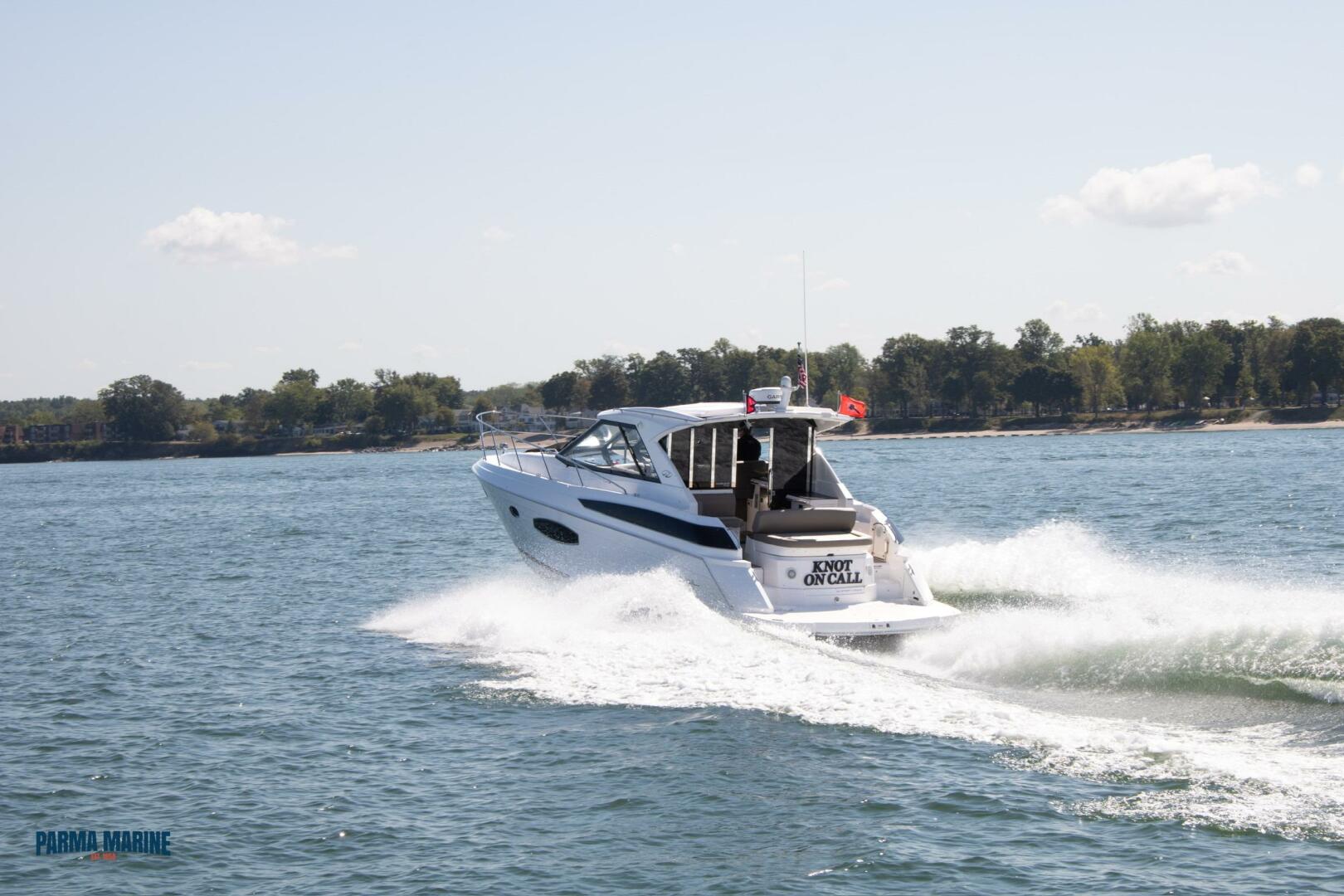 Slide: The Image of Port Stern Side on the 2016 Regal 42 Sport Coupe 2016 Regal 42 Sport Coupe pulling away - 5131634