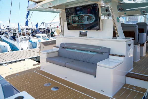 Slide: The Image of 2025 Regal 50 SAV luxury yacht with outdoor seating and entertainment system. - 11