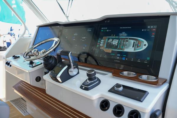 Slide: The Image of Control panel of a 2025 Regal 50 SAV yacht with advanced navigation systems. - 15