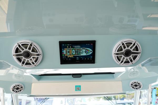 Slide: The Image of Control panel and speakers on the 2025 Regal 50 SAV boat. - 16