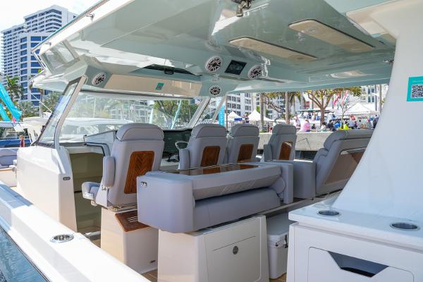 Slide: The Image of 2025 Regal 50 SAV luxury boat interior with seating and modern amenities. - 18