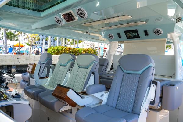 Slide: The Image of Luxurious interior of the 2025 Regal 50 SAV yacht with plush seating and advanced controls. - 19