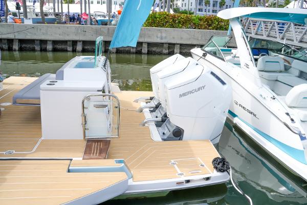 Slide: The Image of 2025 Regal 50 SAV luxury boat with Mercury engines docked. - 9